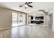 Bright living area with tile floors and sliding glass doors leading to a pool and a modern kitchen at 313 Vista Glen St, Las Vegas, NV 89145