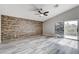 Empty bedroom boasts a decorative accent wall and access to a private balcony at 313 Vista Glen St, Las Vegas, NV 89145