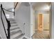 Staircase with wood-look floors and white risers, alongside bathroom access at 313 Vista Glen St, Las Vegas, NV 89145