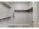 A walk-in closet features modern gray wood-look floors and white shelving at 313 Vista Glen St, Las Vegas, NV 89145