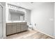 Bright bathroom with double vanity, modern fixtures, and tile floors at 3188 Via Da Vinci, Henderson, NV 89044