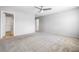 Spacious bedroom featuring plush carpet and ceiling fan at 3188 Via Da Vinci, Henderson, NV 89044