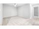 Spacious bedroom with neutral carpet and paint, and two large windows at 3188 Via Da Vinci, Henderson, NV 89044