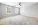 Spacious bedroom featuring plantation shutters, plush carpet and ceiling fan at 3188 Via Da Vinci, Henderson, NV 89044