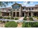 Attractive townhouse exterior with stone accents, desert landscaping, and inviting walkway at 3188 Via Da Vinci, Henderson, NV 89044