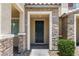 Close-up of front entrance featuring a stylish door, stone accents, and clear address number at 3188 Via Da Vinci, Henderson, NV 89044