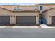 Attached two-car garage with exterior lighting, complementing the home's architectural style at 3188 Via Da Vinci, Henderson, NV 89044