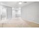 Spacious loft area with carpet, ceiling fan, and natural light at 3188 Via Da Vinci, Henderson, NV 89044