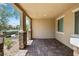 Charming covered patio with brick flooring and stucco walls, perfect for outdoor relaxation at 3188 Via Da Vinci, Henderson, NV 89044