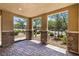 Open patio view with stone pillars offering a glimpse of the meticulously landscaped front yard at 3188 Via Da Vinci, Henderson, NV 89044