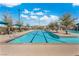 Beautiful community swimming pool with clear blue water and designated depth markings at 3188 Via Da Vinci, Henderson, NV 89044