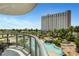 Enjoy city views and the amazing rock-lagoon style pool from the condo's balcony at 322 Karen Ave # 308, Las Vegas, NV 89109