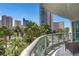 Enjoy this condo balcony's view of the beautifully manicured palm tree landscape at 322 Karen Ave # 308, Las Vegas, NV 89109