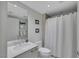 Bright bathroom featuring a shower and white tiled floors, offering a clean and functional space at 322 Karen Ave # 308, Las Vegas, NV 89109
