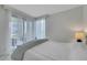 Serene bedroom with sheer curtains and a private balcony overlooking the city at 322 Karen Ave # 308, Las Vegas, NV 89109