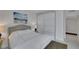 Cozy bedroom with custom closet doors and beach-themed wall art at 322 Karen Ave # 308, Las Vegas, NV 89109