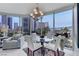 Bright dining area with city views, featuring a glass table and comfortable seating at 322 Karen Ave # 308, Las Vegas, NV 89109