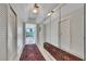 Elegant hallway with reflective mirrors, enhanced by modern lighting fixtures and polished tile floors at 322 Karen Ave # 308, Las Vegas, NV 89109