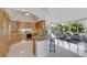 Open concept kitchen with stainless appliances and granite countertops flows into the living room at 322 Karen Ave # 308, Las Vegas, NV 89109