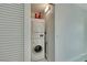 Efficient laundry closet with stacked washer and dryer for space-saving convenience at 322 Karen Ave # 308, Las Vegas, NV 89109