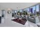 Living room with city views, tile floors, and comfortable seating near floor-to-ceiling windows at 322 Karen Ave # 308, Las Vegas, NV 89109
