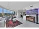 Open-concept living room with floor-to-ceiling windows and modern furnishings at 322 Karen Ave # 308, Las Vegas, NV 89109