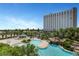 This rock-lagoon style pool features a waterfall and lush landscaping at 322 Karen Ave # 308, Las Vegas, NV 89109