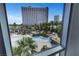 Bright views of pool and lush landscaping seen from window at 322 Karen Ave # 308, Las Vegas, NV 89109