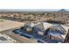 Neighborhood aerial shot showcasing tile roofs, desert landscaping, and streetscapes in a residential community at 340 Autumn Palace Ct, Las Vegas, NV 89144