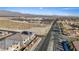 Neighborhood view showcases modern homes near schools, set against a backdrop of desert landscape and distant mountains at 340 Autumn Palace Ct, Las Vegas, NV 89144