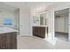 Bathroom featuring a double vanity, a glass-enclosed shower, and a walk-in closet at 340 Autumn Palace Ct, Las Vegas, NV 89144