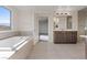 Bright bathroom with a large soaking tub and a double vanity at 340 Autumn Palace Ct, Las Vegas, NV 89144