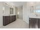 Elegant bathroom featuring dual vanities and a large glass-enclosed shower at 340 Autumn Palace Ct, Las Vegas, NV 89144