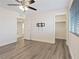 Bright bedroom featuring a ceiling fan, a closet, and modern gray flooring at 340 Autumn Palace Ct, Las Vegas, NV 89144