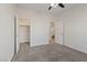 Bedroom with a ceiling fan, soft carpet, and access to a walk-in closet at 340 Autumn Palace Ct, Las Vegas, NV 89144