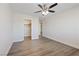 Bright bedroom featuring a ceiling fan, a closet, and modern gray flooring at 340 Autumn Palace Ct, Las Vegas, NV 89144