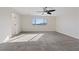 Bright bedroom with a ceiling fan and large window that has views of the surrounding mountains at 340 Autumn Palace Ct, Las Vegas, NV 89144