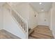 Bright entryway featuring sleek floors and a staircase leading to the upper level of the home at 340 Autumn Palace Ct, Las Vegas, NV 89144