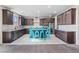 Stylish kitchen with modern appliances, island with seating, granite countertops, and ample cabinet space at 340 Autumn Palace Ct, Las Vegas, NV 89144