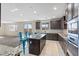 Bright kitchen featuring stainless steel appliances, granite counters, tile backsplash and an island with seating at 340 Autumn Palace Ct, Las Vegas, NV 89144
