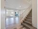 Open living room area featuring sleek floors, recessed lighting, open floor plan and staircase to the second floor at 340 Autumn Palace Ct, Las Vegas, NV 89144