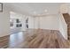 Spacious living room showcasing sleek floors, recessed lighting, and an open floor plan into the kitchen and dining area at 340 Autumn Palace Ct, Las Vegas, NV 89144