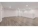 This open loft features vinyl floors, recessed lights, and a staircase with white railing at 340 Autumn Palace Ct, Las Vegas, NV 89144