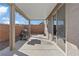 Covered patio includes a grill, concrete flooring, and access to the home's sliding glass door at 340 Autumn Palace Ct, Las Vegas, NV 89144