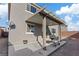Back patio is covered and provides an outdoor living space with landscaping and backyard access at 340 Autumn Palace Ct, Las Vegas, NV 89144
