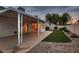 Spacious backyard with covered patio, low-maintenance landscaping, and privacy wall at 3426 Side Saddle Ct, North Las Vegas, NV 89032