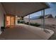 Backyard featuring a covered patio, concrete tiles, and artificial turf at 3426 Side Saddle Ct, North Las Vegas, NV 89032