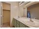 Bright bathroom featuring dual sinks, spacious counters, and a walk-in closet at 3426 Side Saddle Ct, North Las Vegas, NV 89032