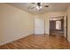 Bedroom featuring wood floors, ceiling fan, and closet at 3426 Side Saddle Ct, North Las Vegas, NV 89032