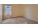 Bright bedroom featuring neutral carpet, white curtains, and a window with natural light at 3426 Side Saddle Ct, North Las Vegas, NV 89032